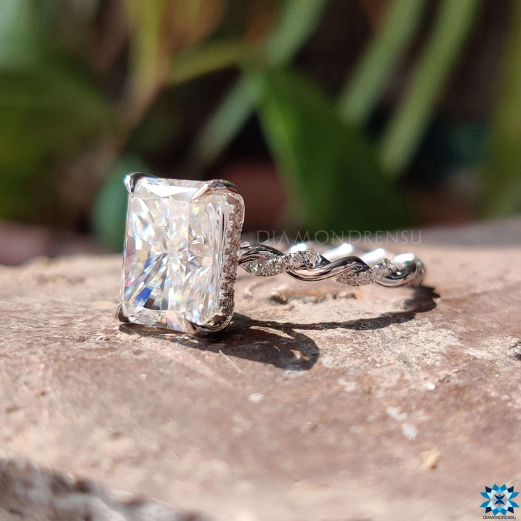 White gold moissanite ring with 4 prong claw setting.
