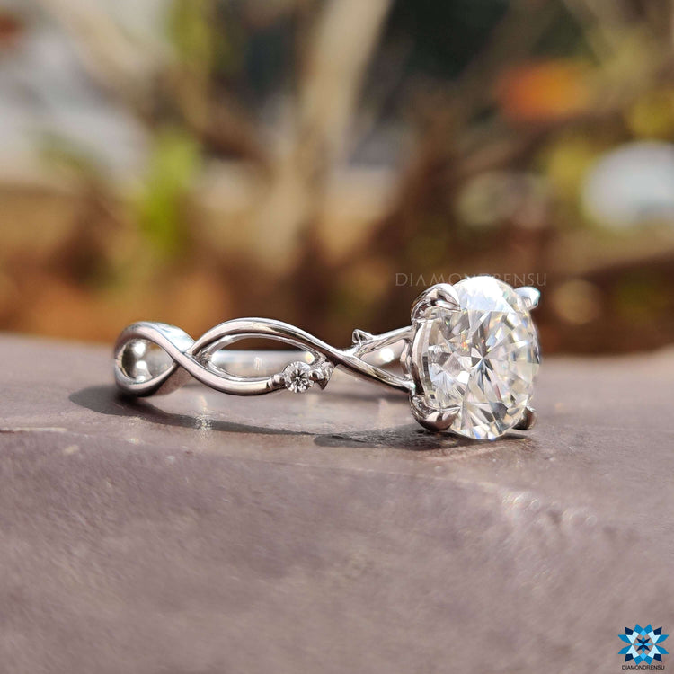 White gold ring with 4 claw prong setting.

