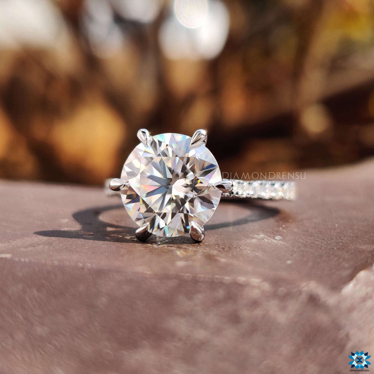Cathedral style moissanite ring in white gold.
