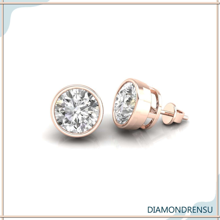 Lab grown diamond earrings in round bezel format.
