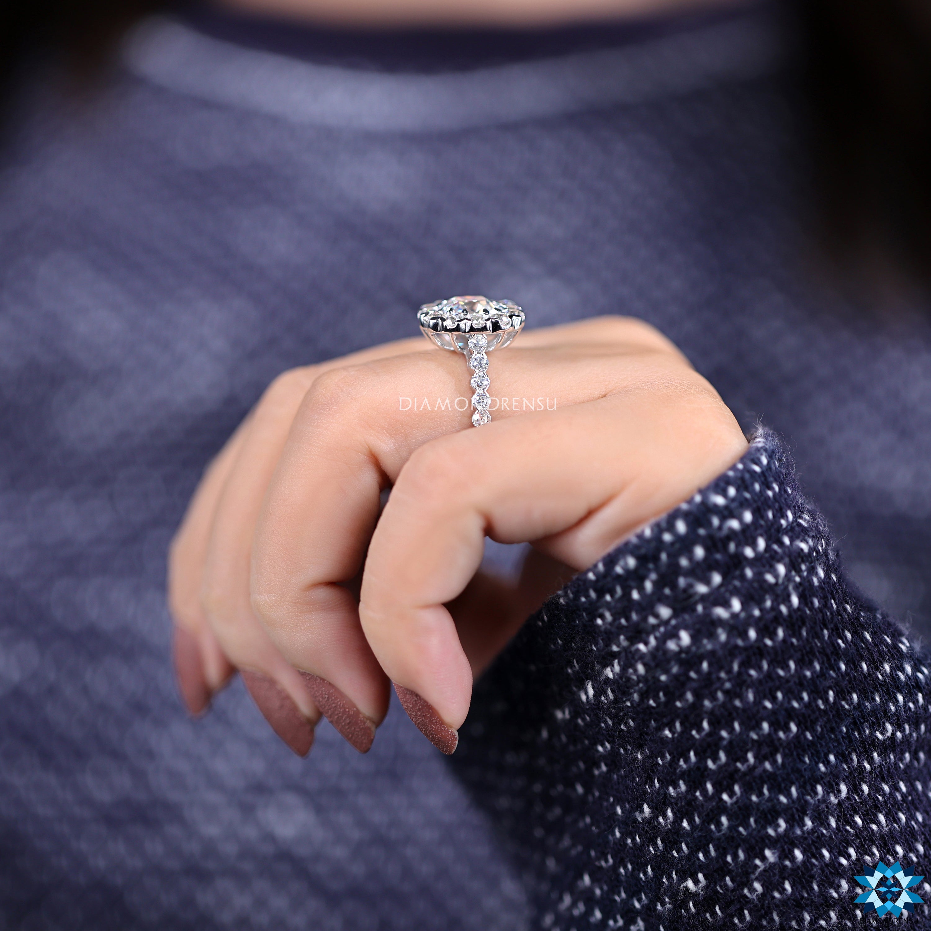 Buy moissanite ring with halo design and white gold claw prongs.
