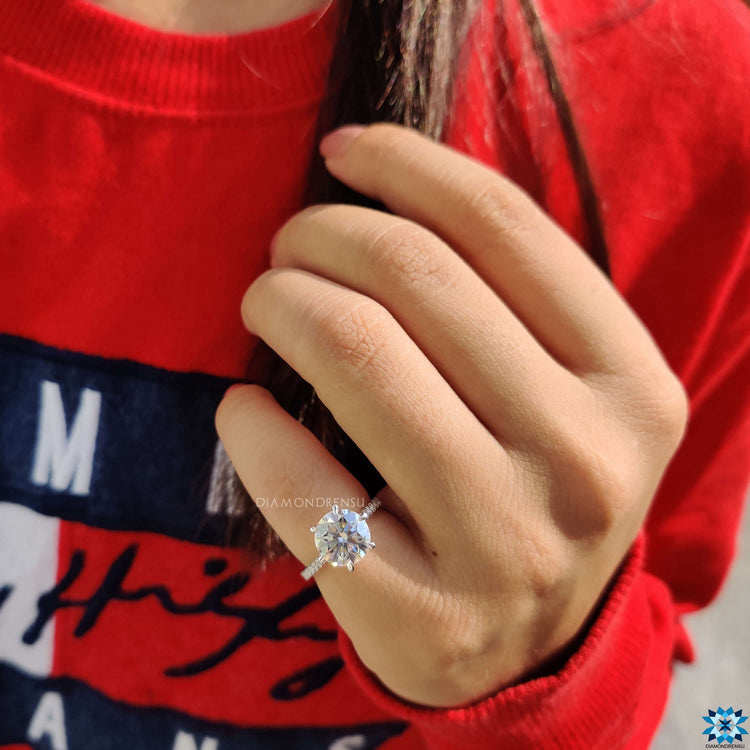 Custom engagement ring with round cut center.

