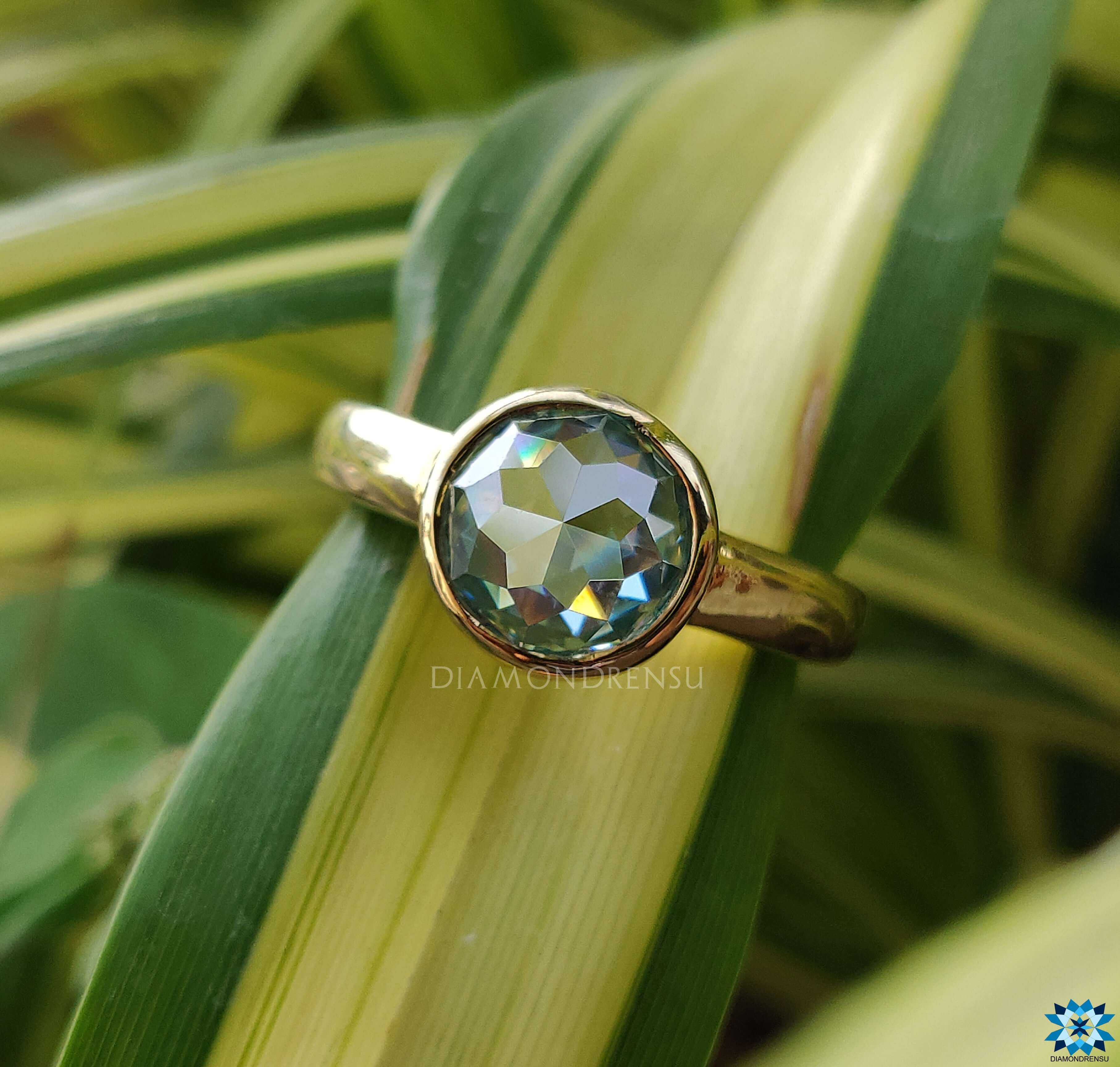 Dazzling blue moissanite ring set to capture attention with its vibrant hue.
