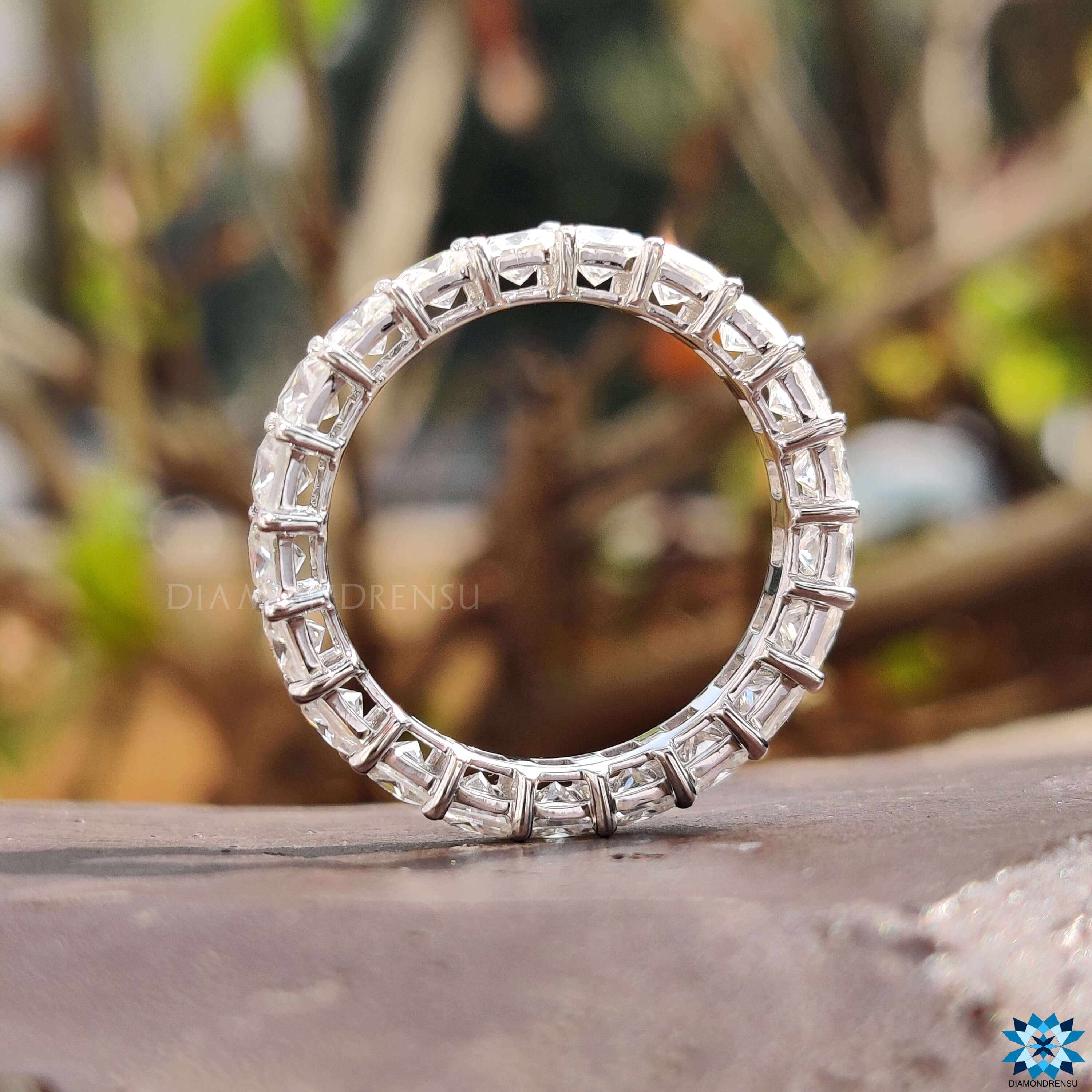 Sparkling eternity princess ring, featuring a square diamond band with colorless moissanite.