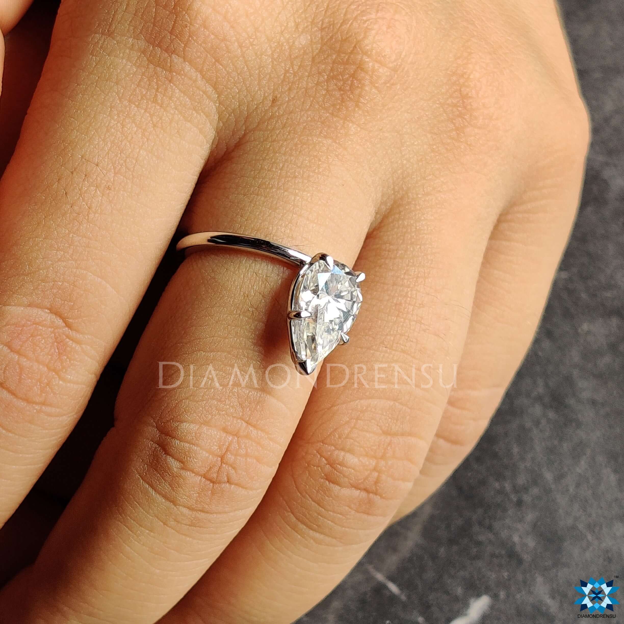 Handmade ring with a gorgeous pear moissanite engagement ring set in white gold ring.