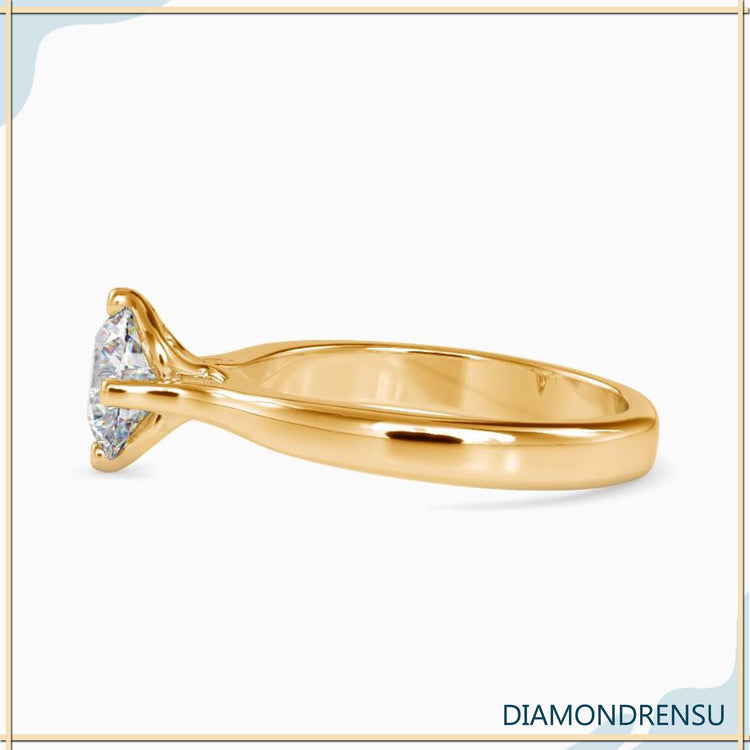 Diamondrensu UK ring with round solitaire and 4 prong look.
