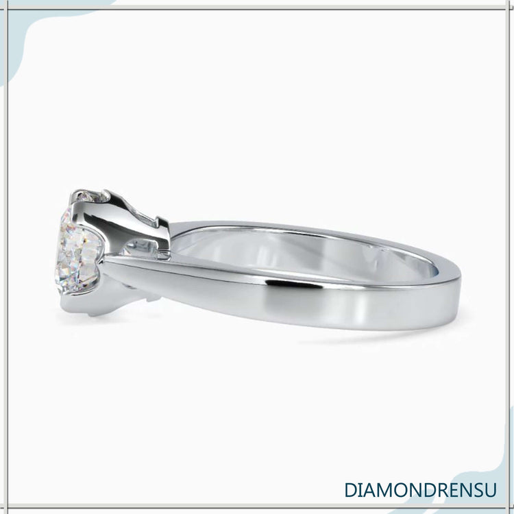 Rose gold ring with round diamond in classic solitaire style.
