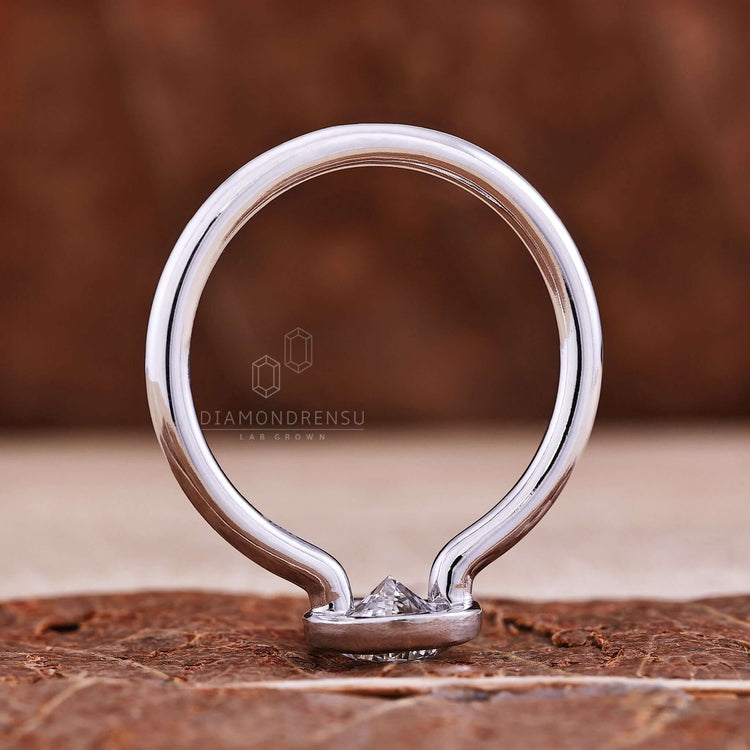 Knife edge engagement ring with a pear shape diamond to highlight its unique design
