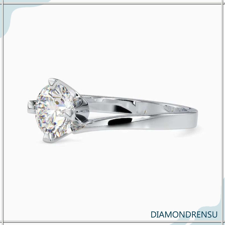 Simple diamond ring with polished metal band
