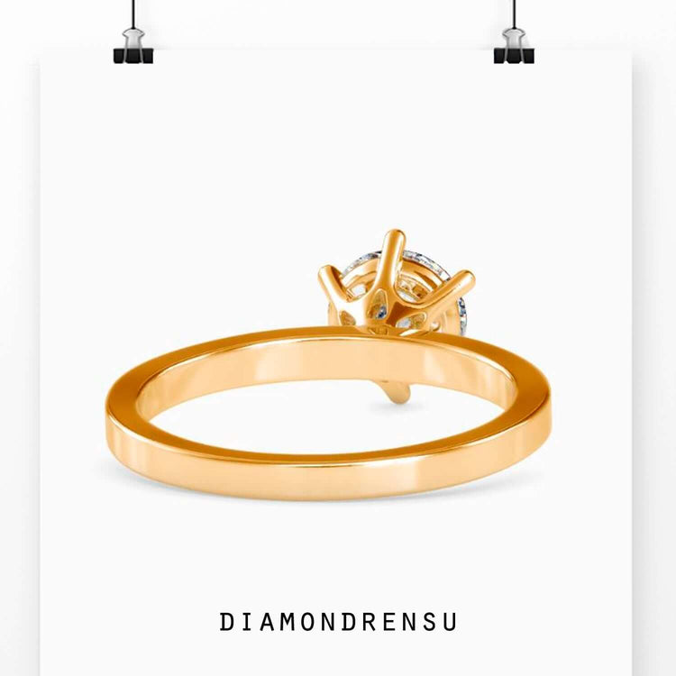 Lab diamond ring with round cut stone in white gold.
