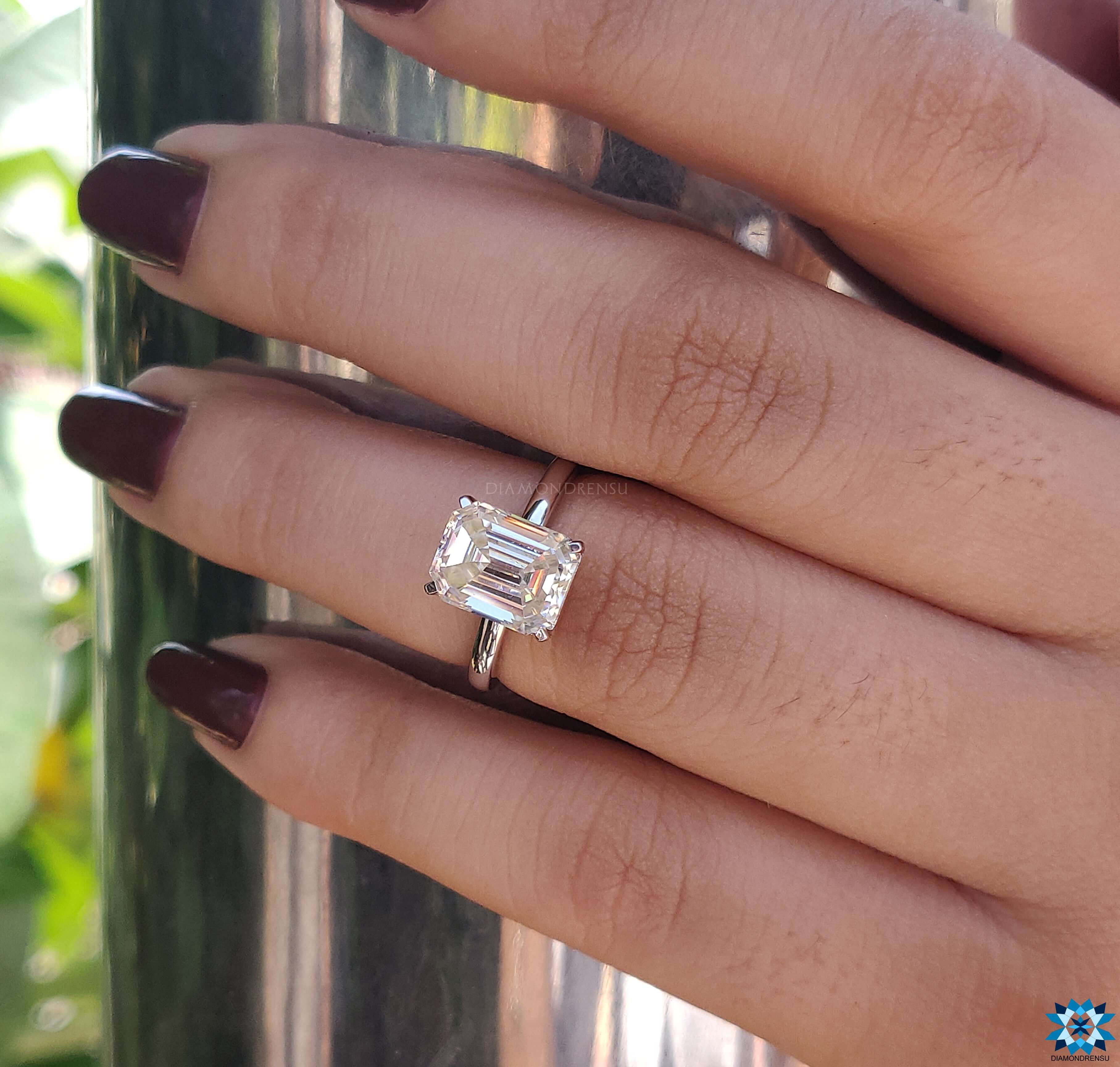 Handmade ring featuring an Emerald Cut Moissanite Ring in a white gold band.