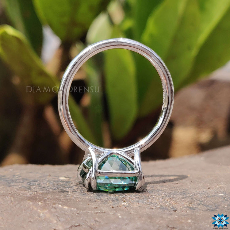 Handmade green moissanite engagement ring.
