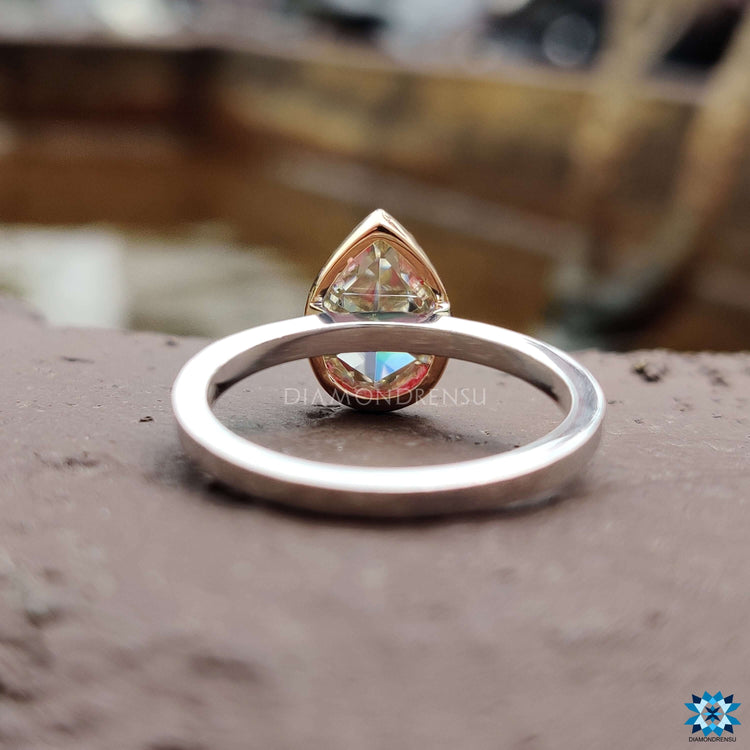 Custom handmade pear shaped moissanite ring with prong setting.
