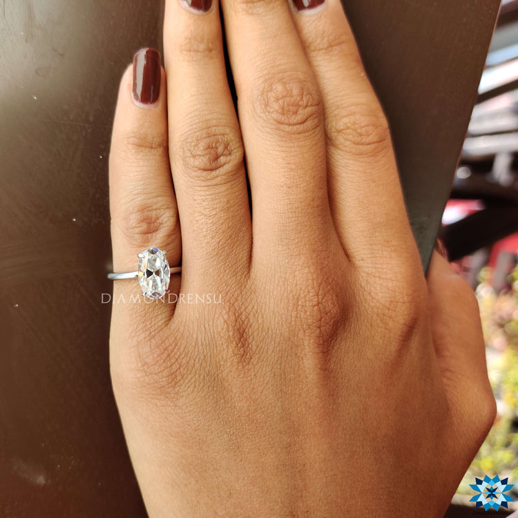 White gold engagement ring with Moval cut center stone.
