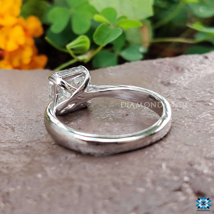 Custom white gold moissanite ring with prong setting.
