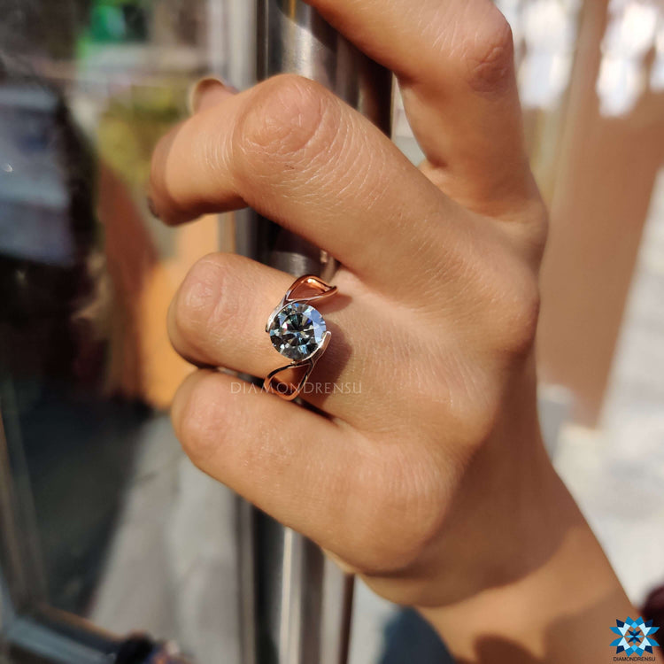 Handmade jewelry featuring gray moissanite in tension setting.
