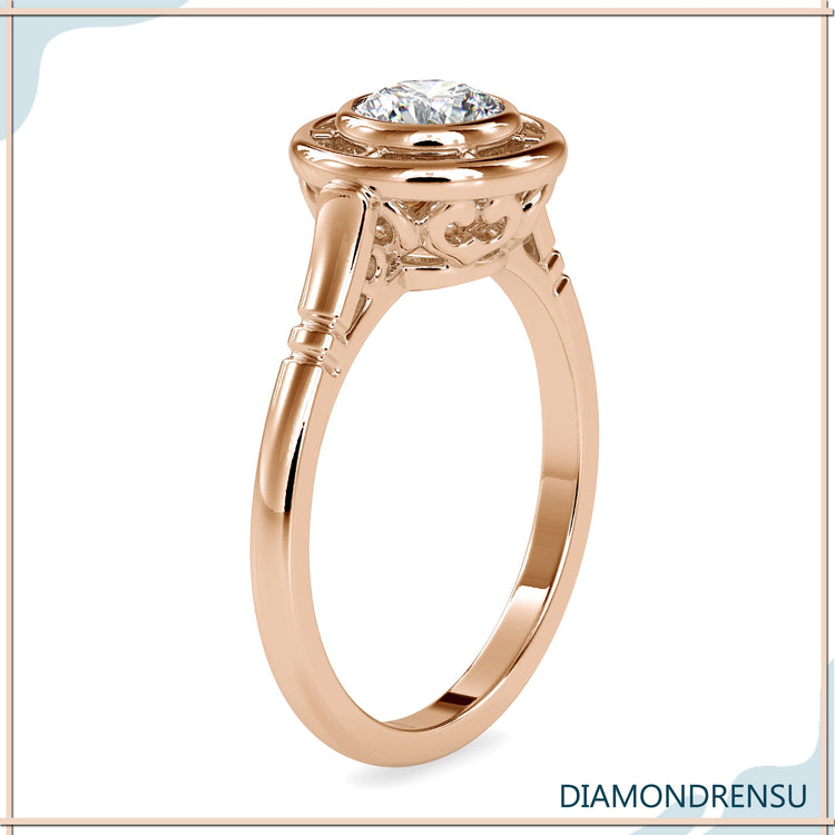 Designer engagement ring with custom bezel solitaire style.

