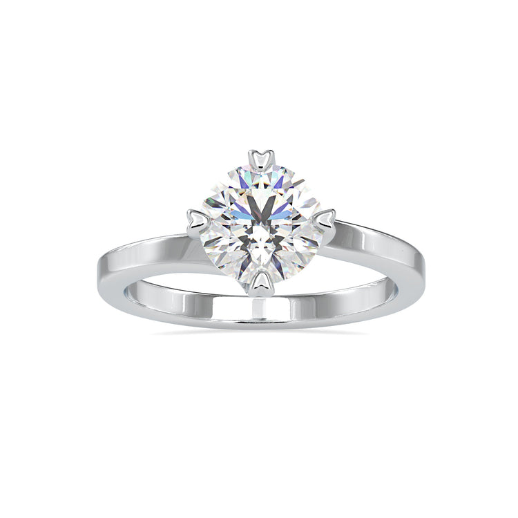 Designer ring with heart prong and round diamond setting.
