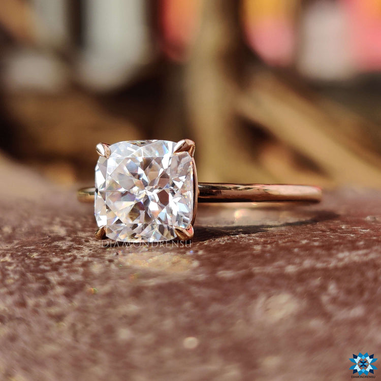 Custom handmade ring showcasing a cushion Rensu cut moissanite.
