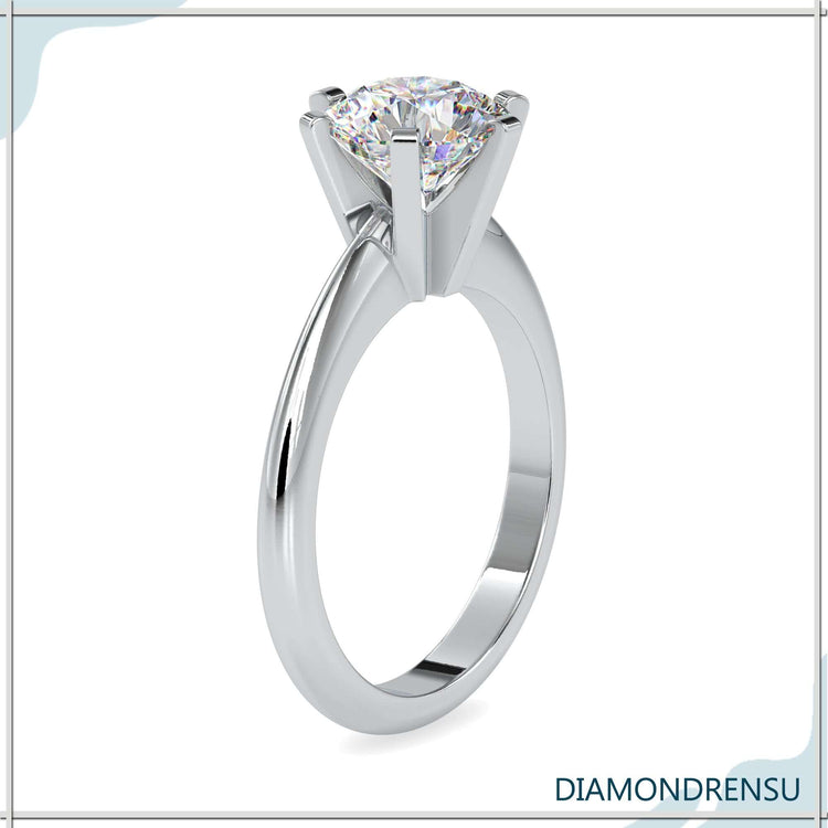 UK engagement ring with simple solitaire and six prong setting.
