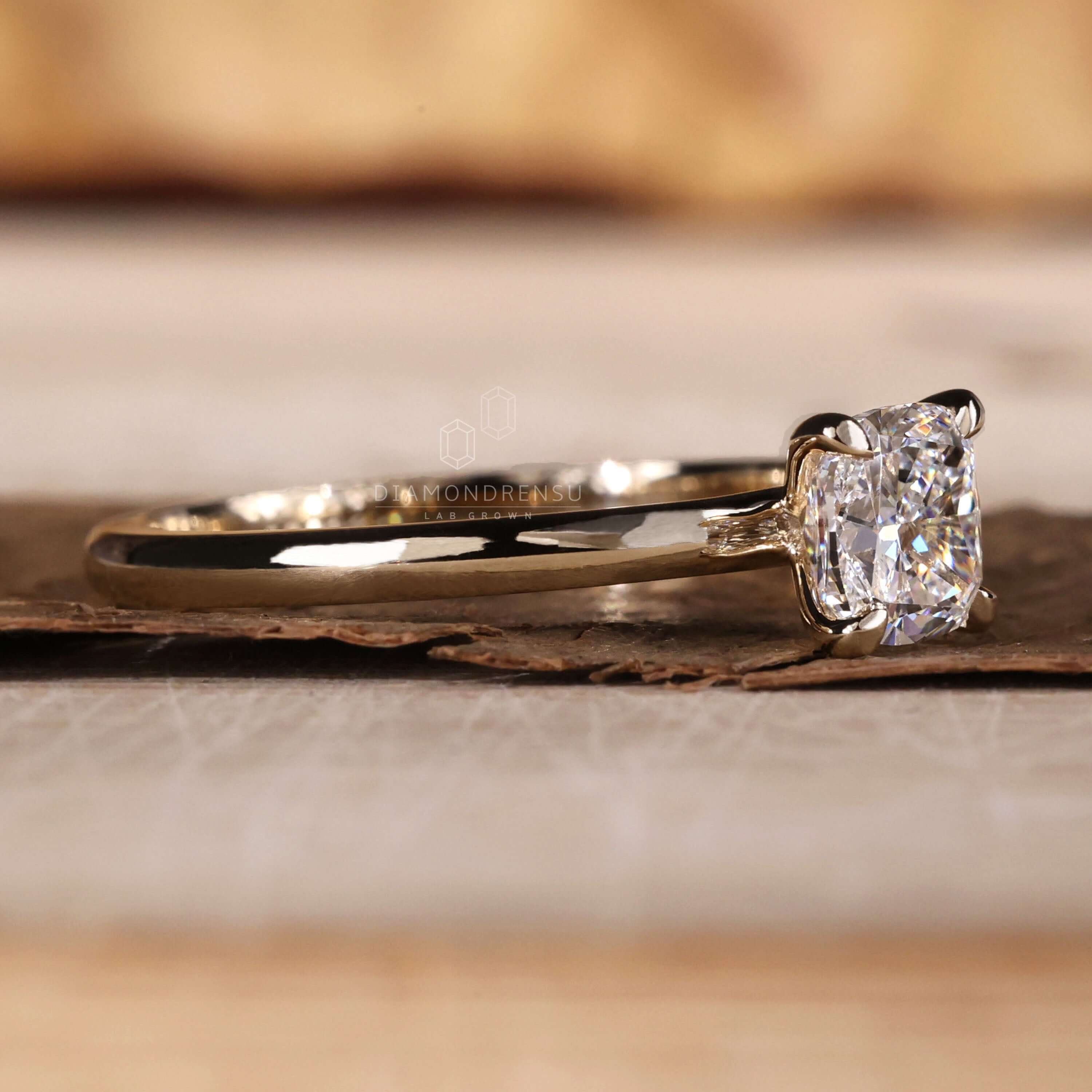 Cushion cut diamond ring designed with a solitaire diamond for women who appreciate classic and unique engagement styles.
