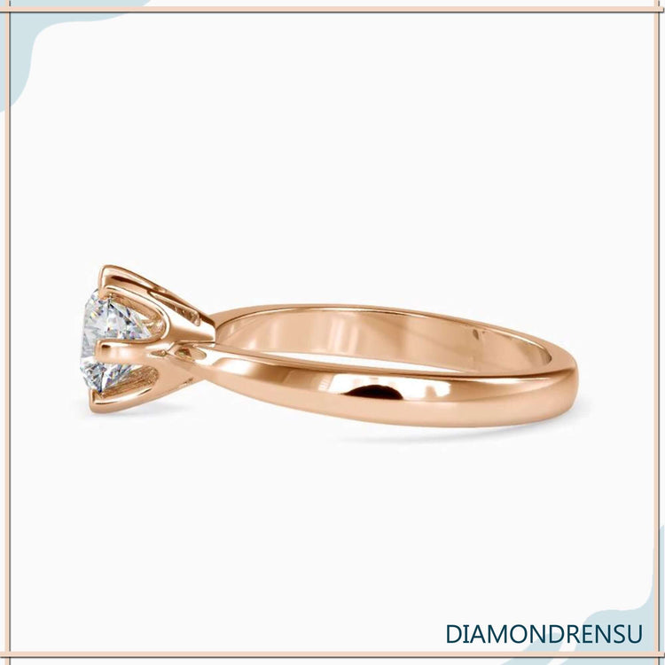 Yellow gold diamond ring with solitaire setting and lab diamond.
