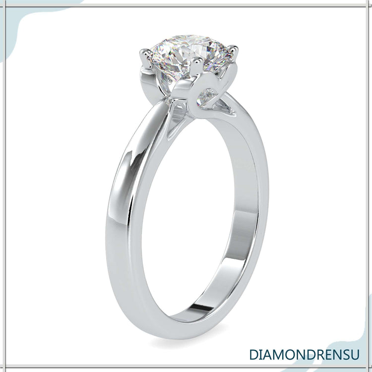 Designer solitaire ring with round diamond and hidden heart touch.
