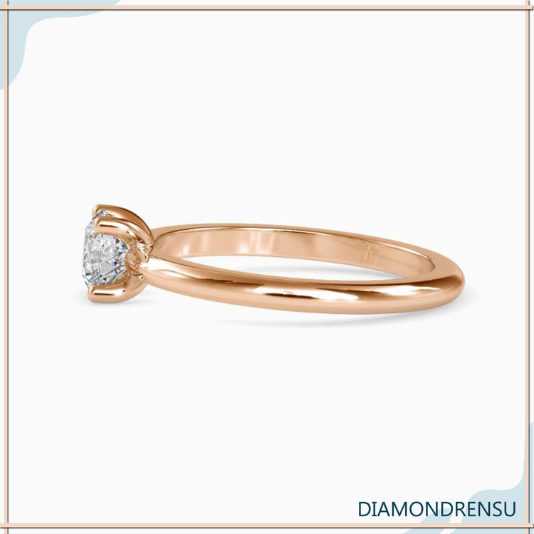 Buy diamond ring with round solitaire in four prong setting.

