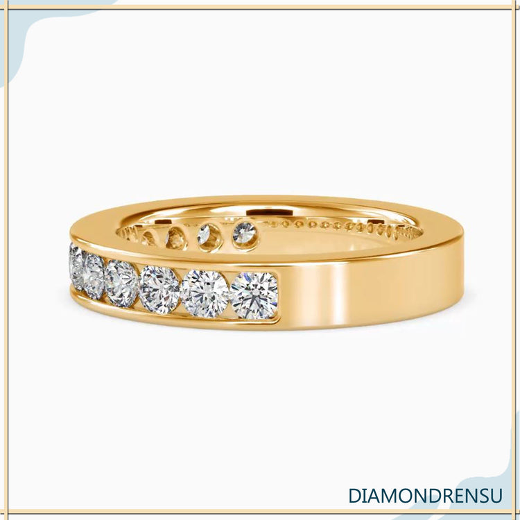 Channel wedding ring with lab grown round cut stones.
