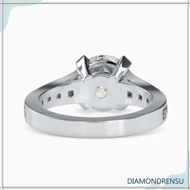 UK diamond ring with channel set and trapezium pave style.
