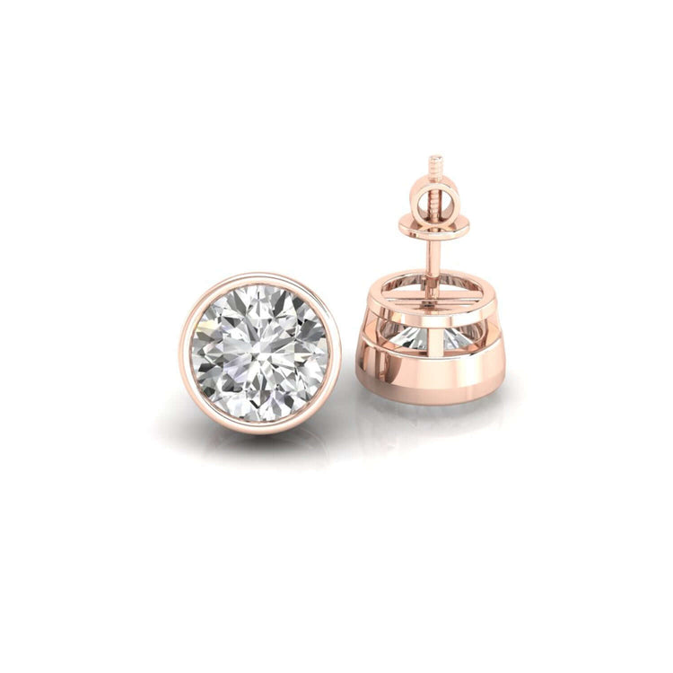 Gold diamond earrings featuring round lab stones.
