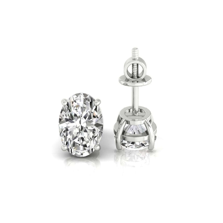 Handmade jewellery featuring oval cut diamond gold stud earrings.
