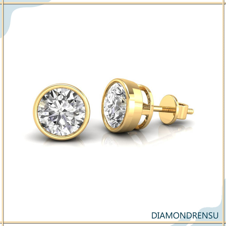 Handmade bezel diamond earrings with lab grown round diamonds in rose gold.
