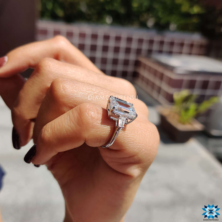 Three stone moissanite engagement ring in white gold.
