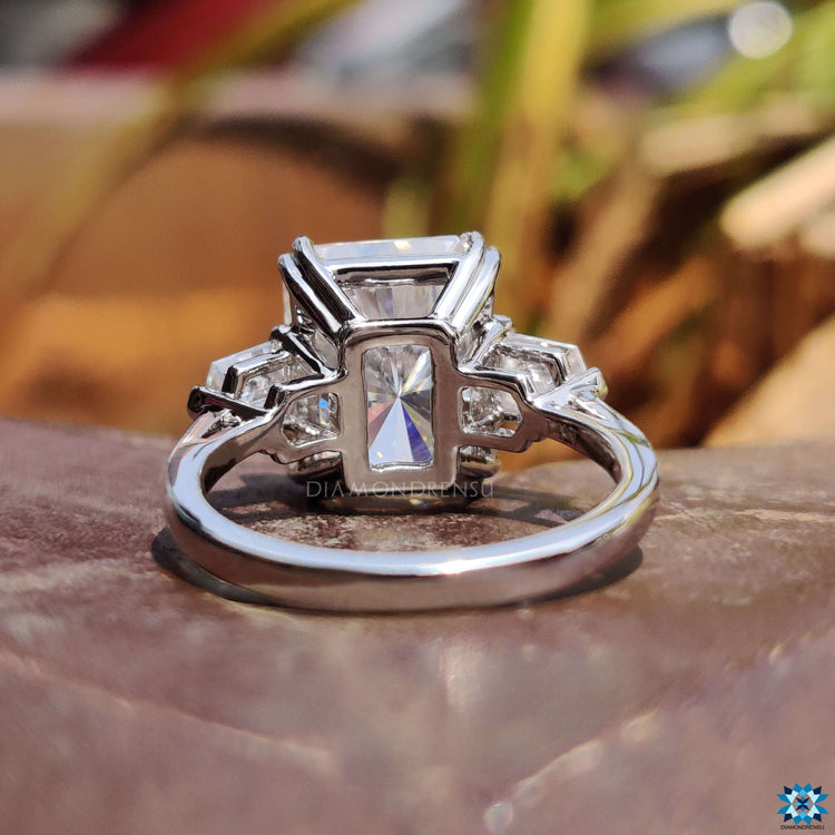 White gold engagement ring featuring radiant and bullet cut stones.
