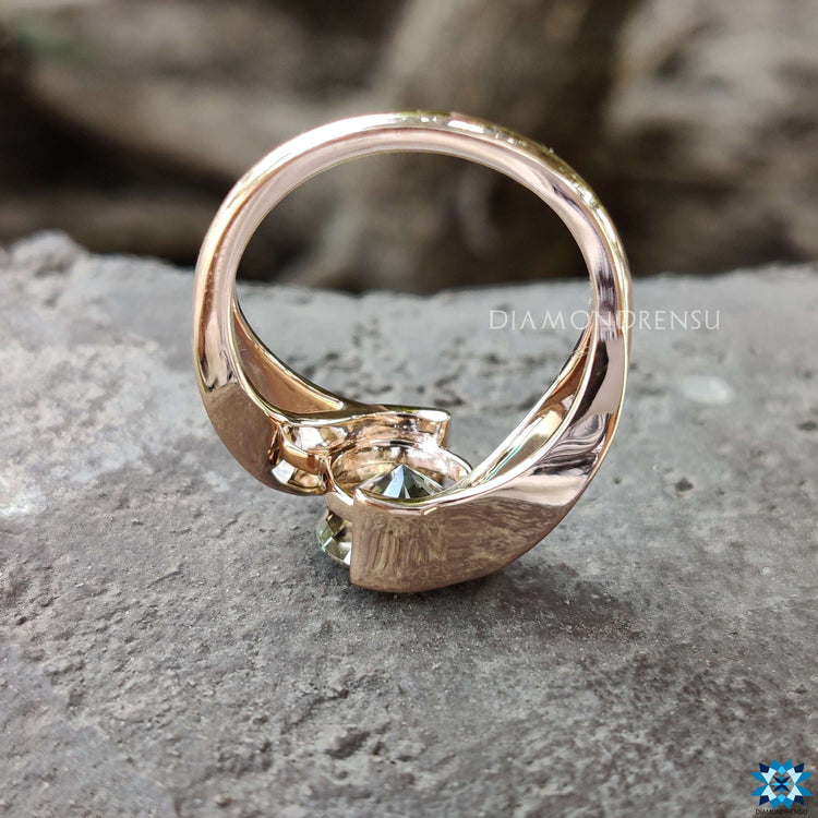 Custom engagement ring with gray moissanite in tension mount.
