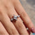 Lozenge cut ring featured in a beautiful 3 stone moissanite ring.