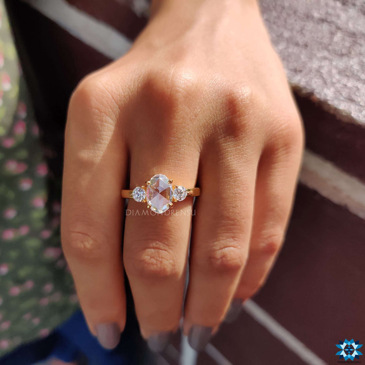 Three stone engagement ring with old European cut side stones.
