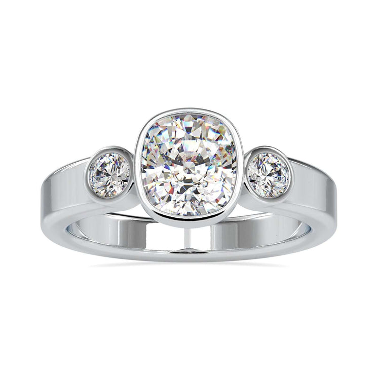 Cushion cut diamond engagement ring with round side stones.
