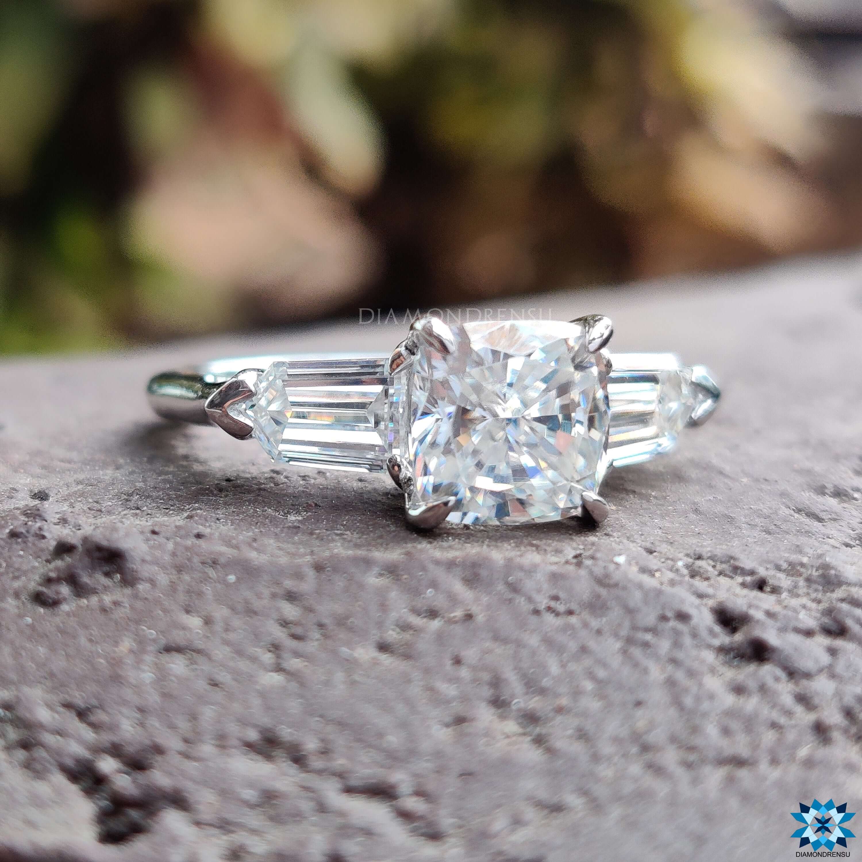 White gold moissanite ring featuring a gorgeous three stone engagement ring for added brilliance.