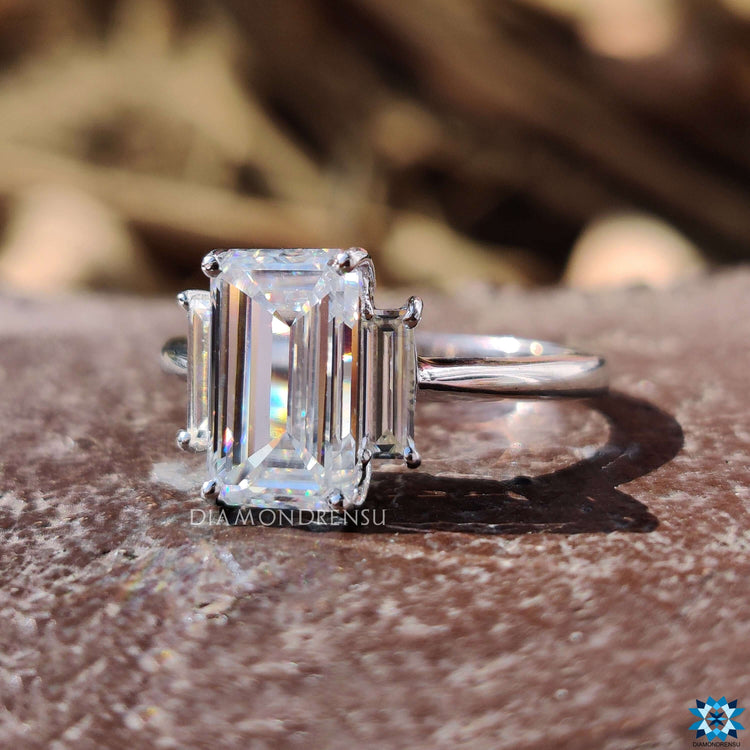 Cushion cut moissanite ring with a cathedral-style band.

