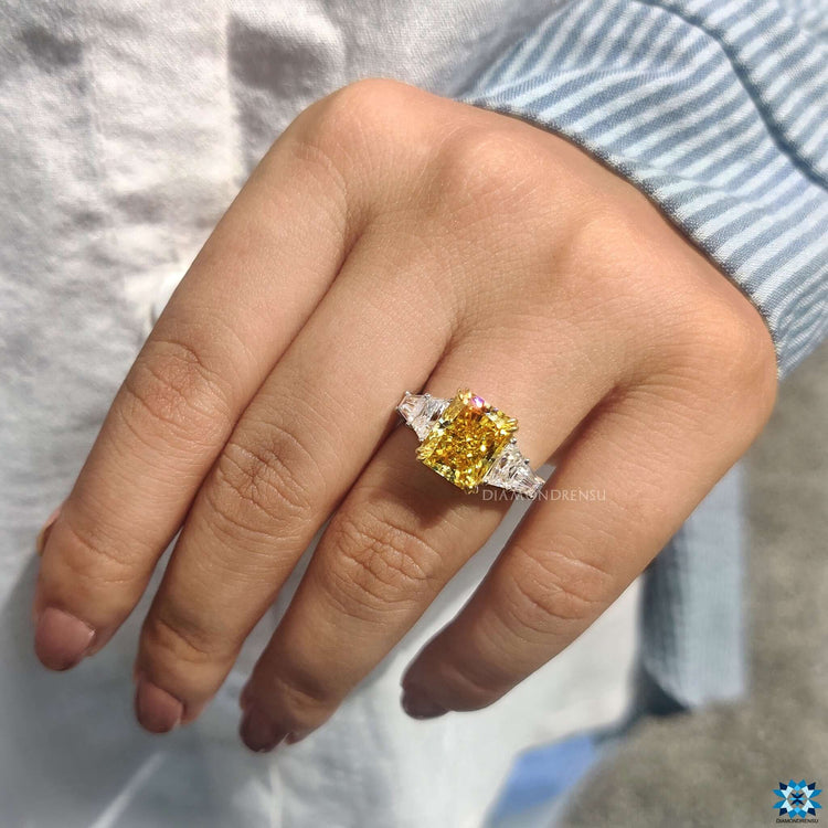 Radiant cut moissanite ring with double claw prong setting.
