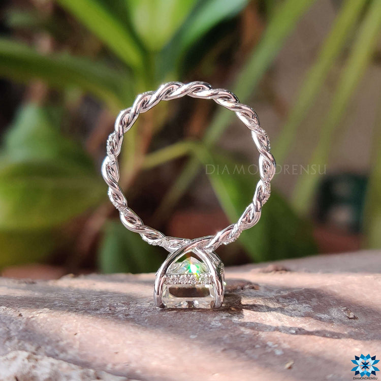 Twisted band engagement ring with pave setting.

