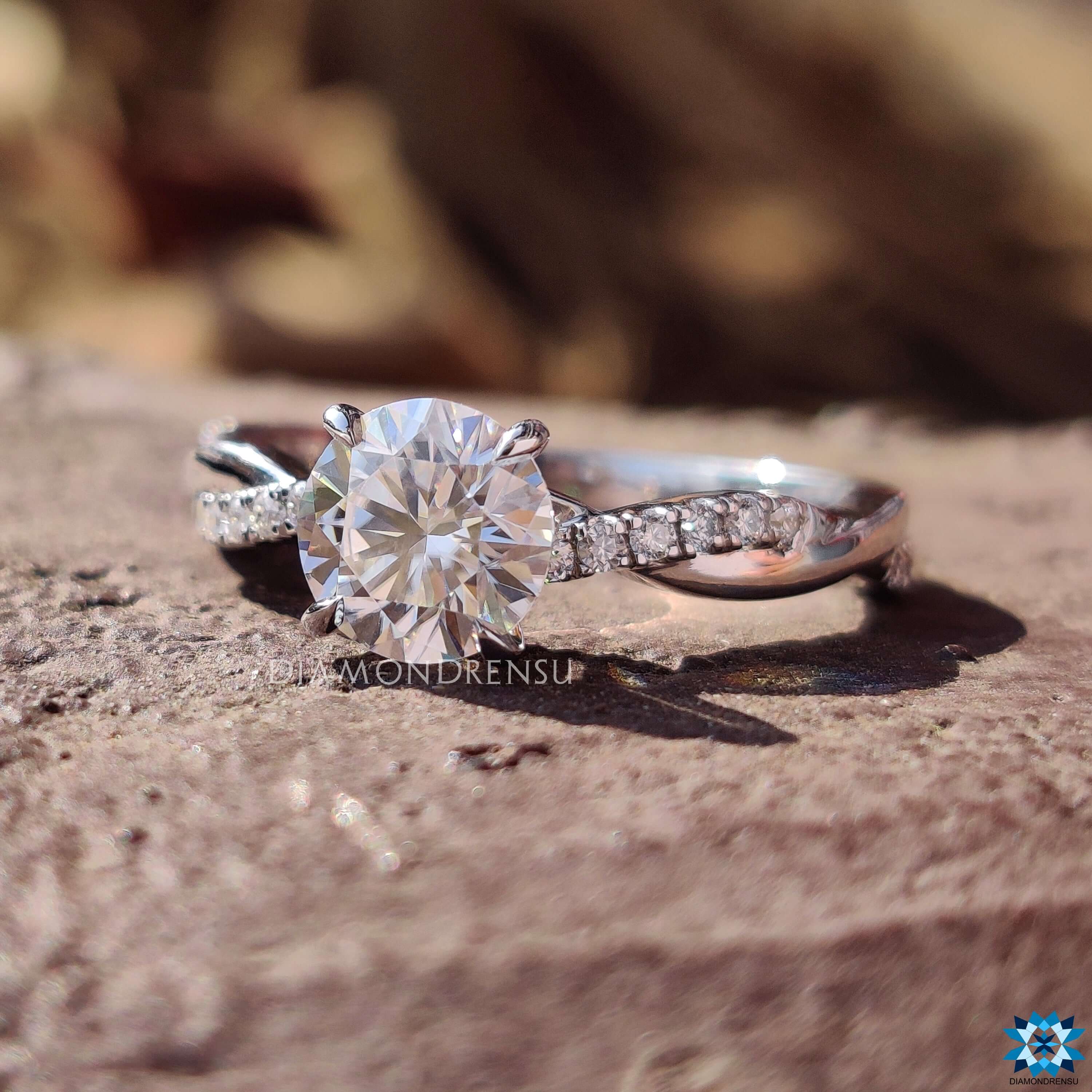 White gold moissanite ring featuring a secure claw prong ring setting.