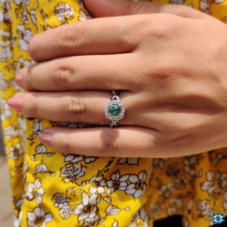 Custom moissanite ring in blue tone.