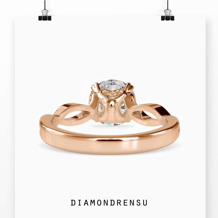 Yellow gold diamond ring with elegant twist setting.
