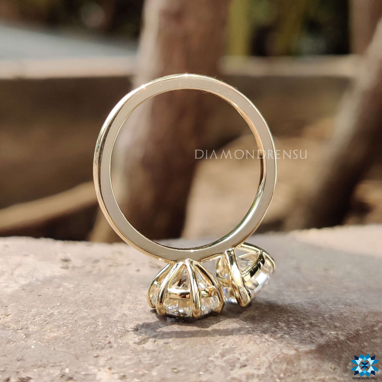 Handmade two stone moissanite engagement ring.
