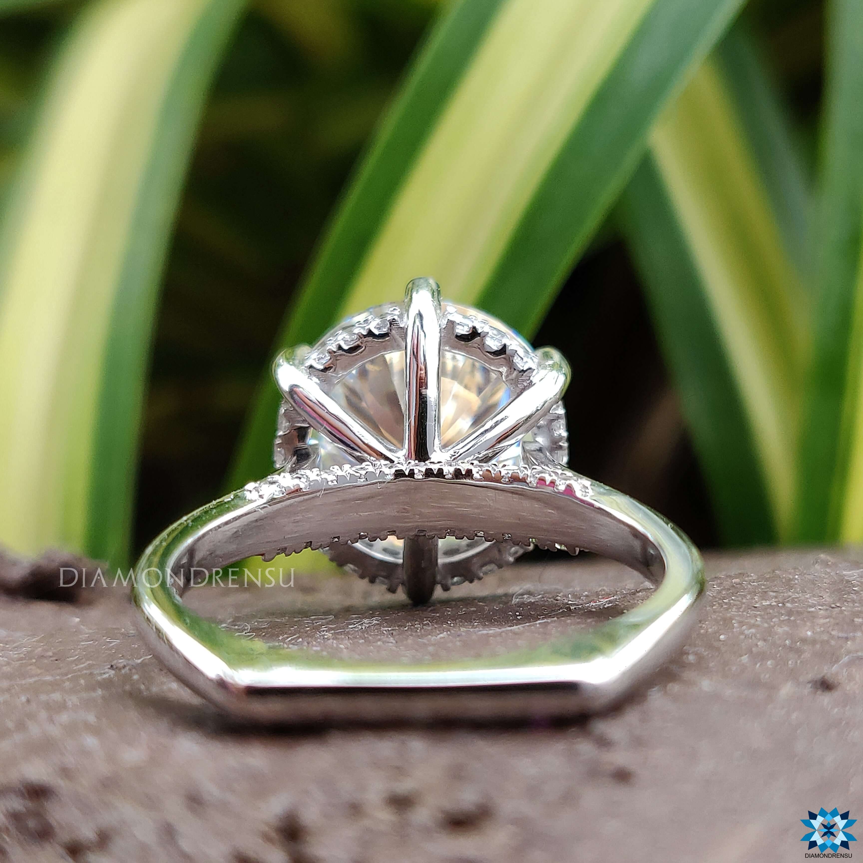 Round brilliant cut ring with hidden halo moissanite for a sophisticated look.