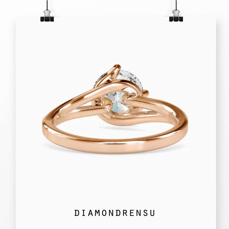 Yellow gold diamond ring with designer solitaire setting.
