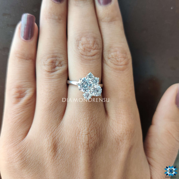 Moissanite engagement ring designed with five round stones.
